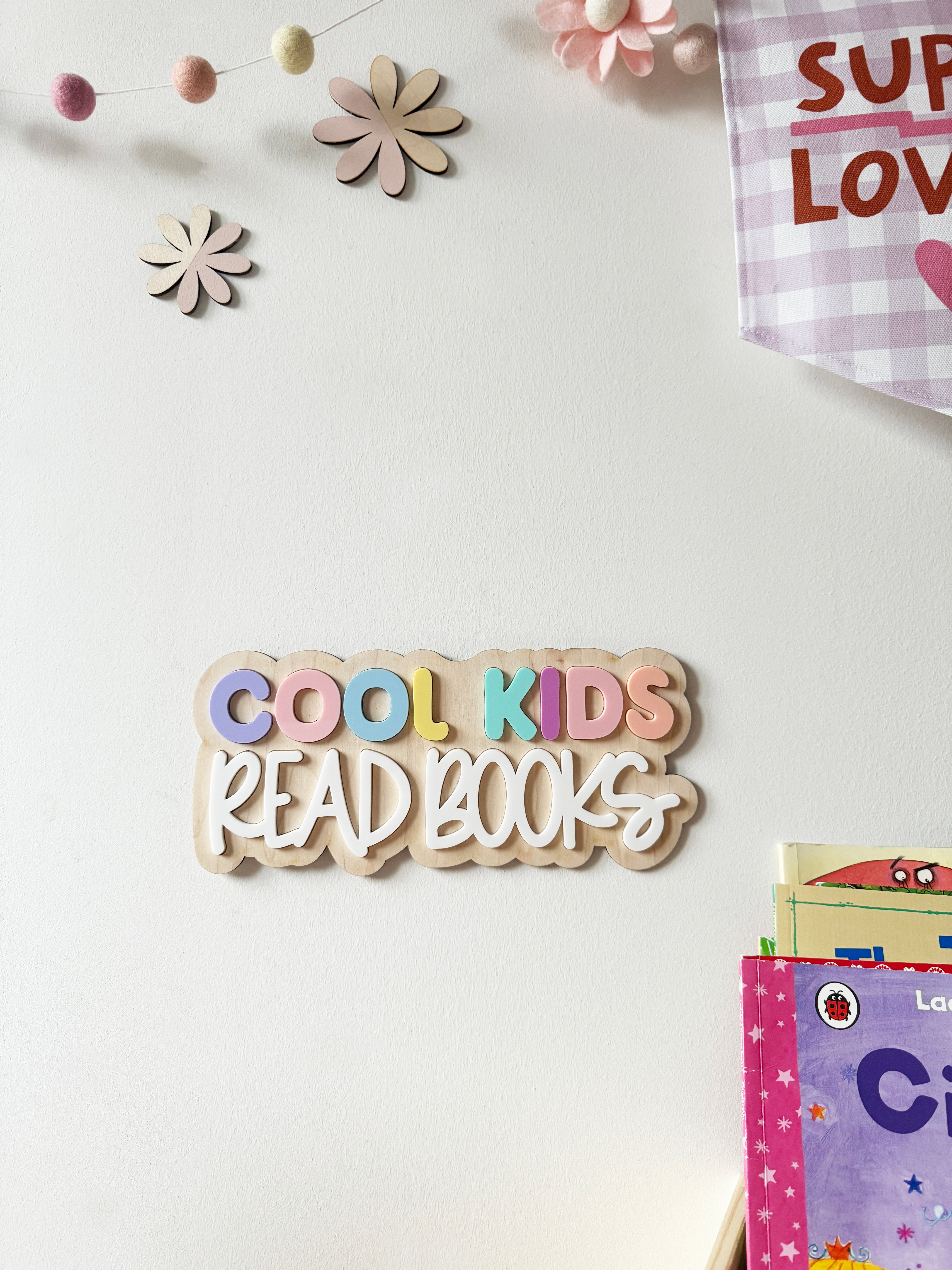Cool kids read books pastel shades wall sign