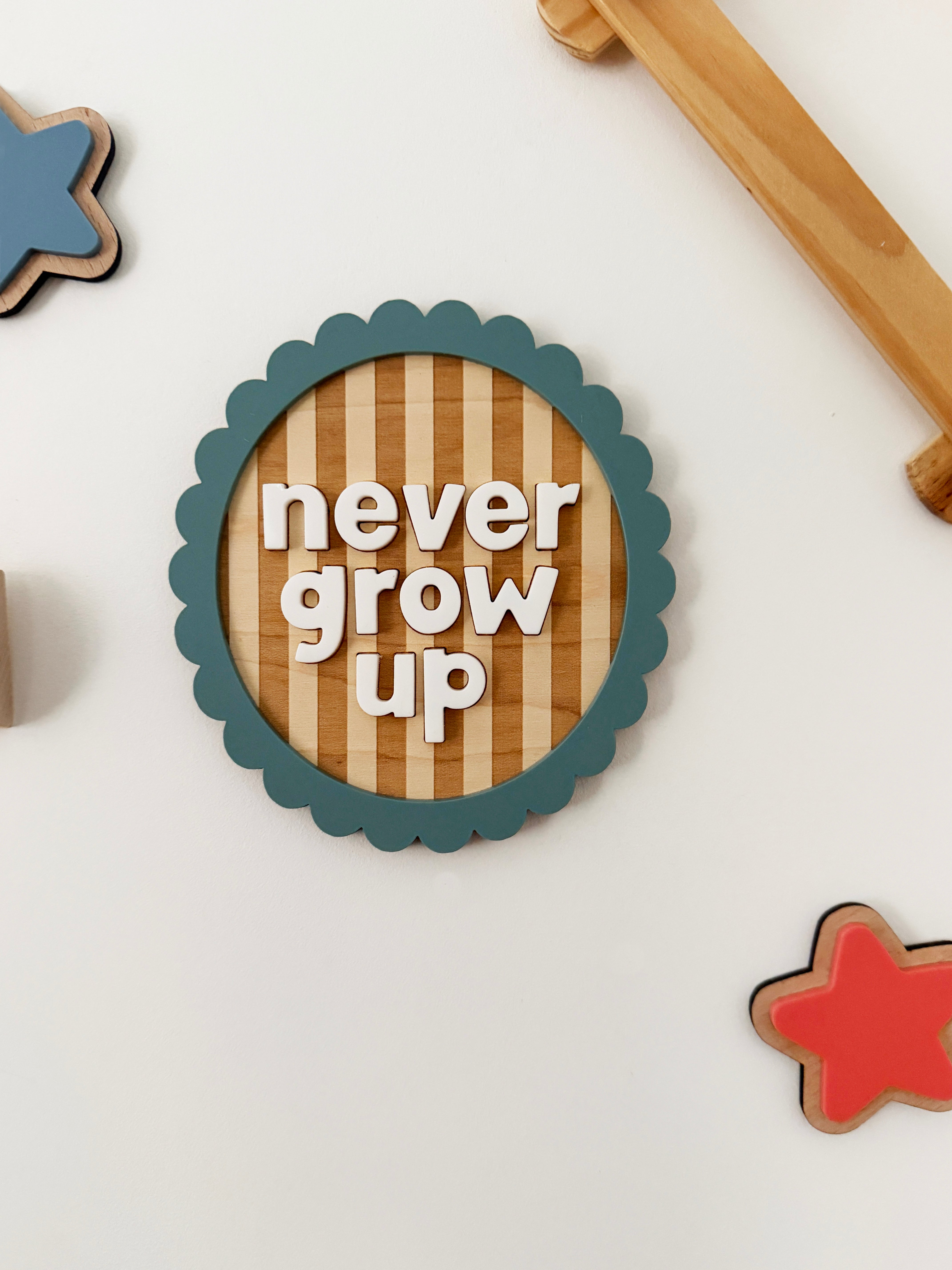 Never grow up scallop wall plaque