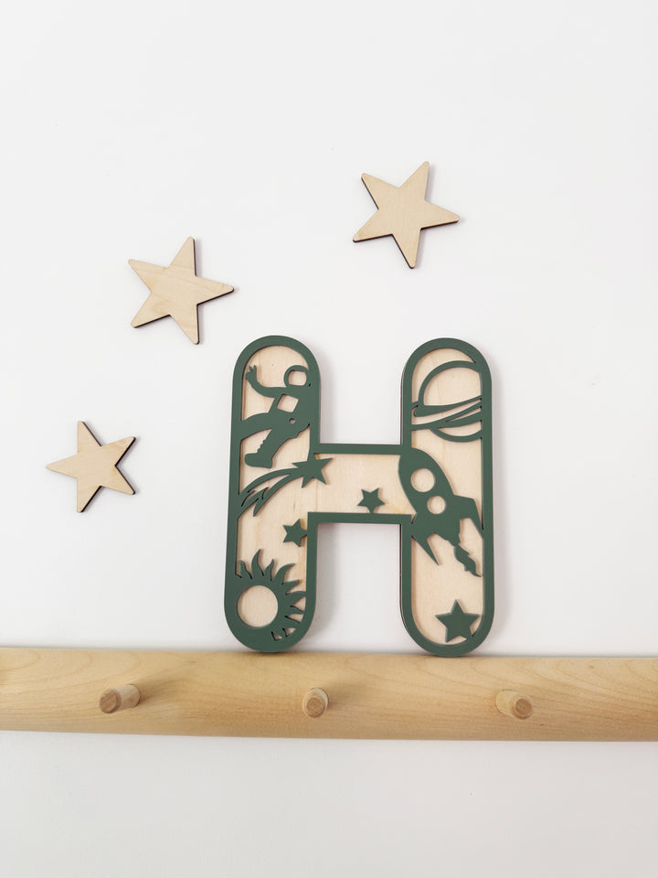 Space themed initial letter